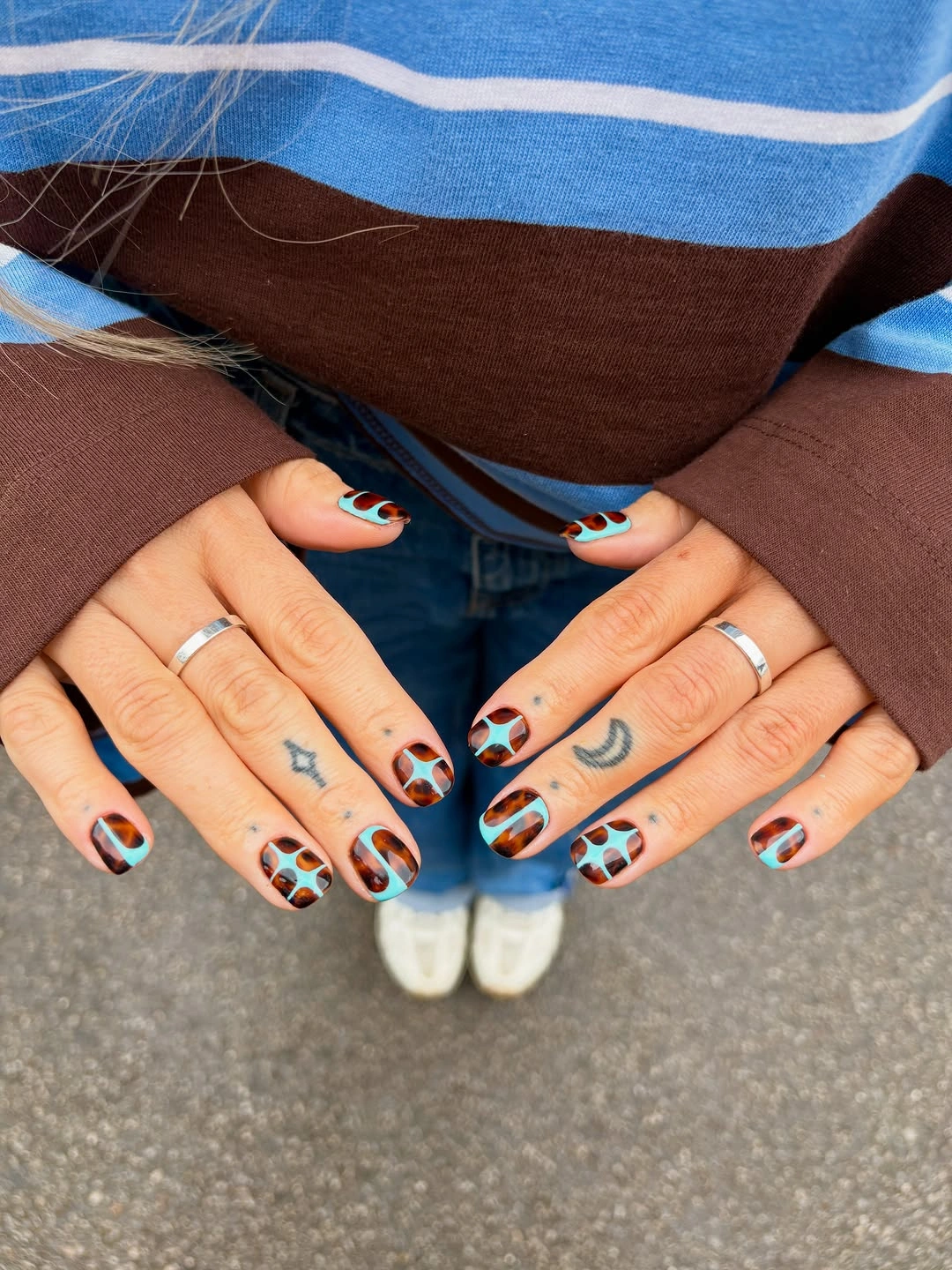 Short nails with turquoise brown and black abstract spots