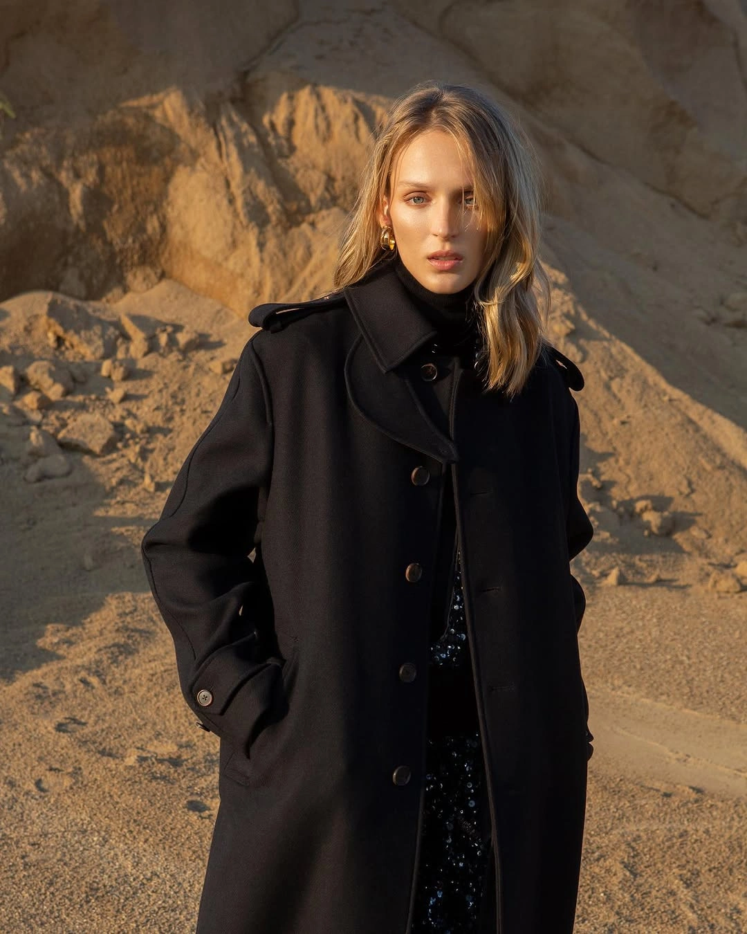 Structured black long coat with shiny black lower layer