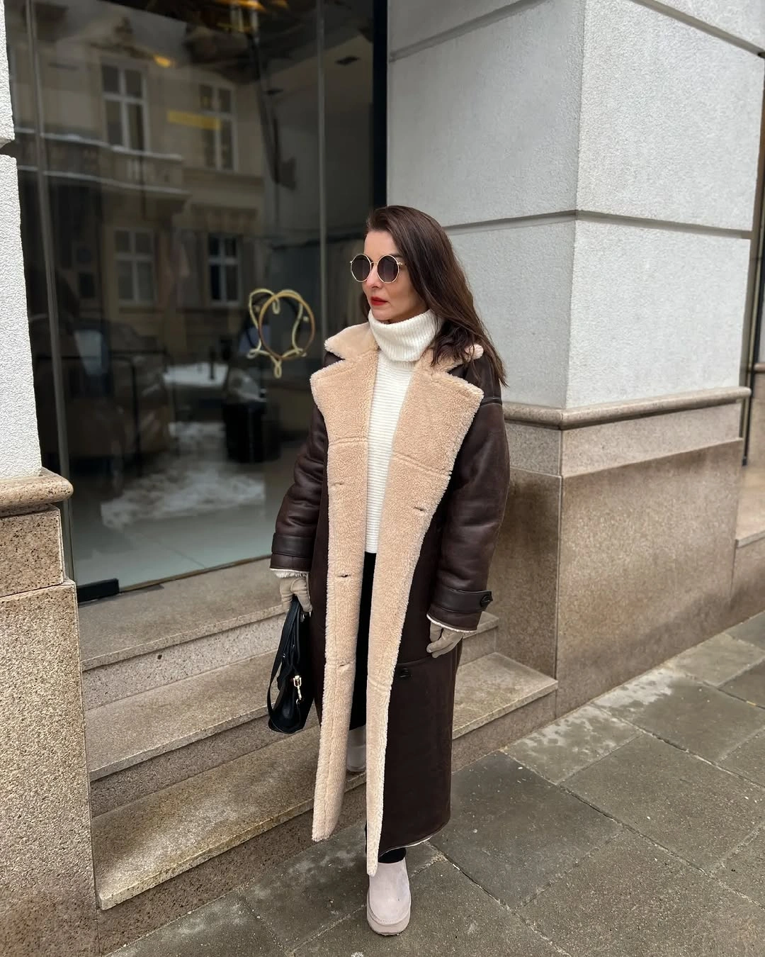 Dark brown coat with light front panel and white turtleneck