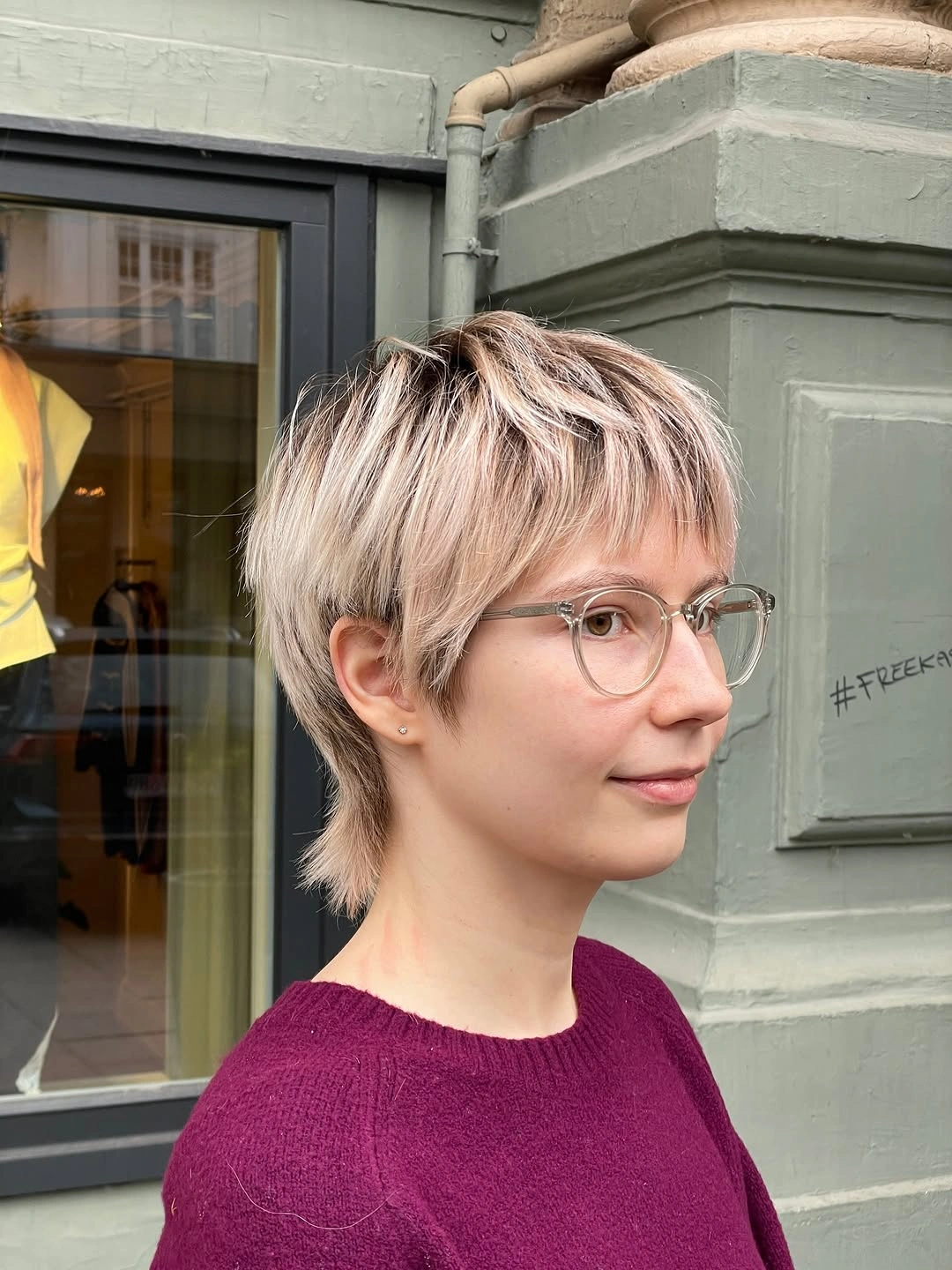 Short light pixie crop with choppy baby fringe and longer nape