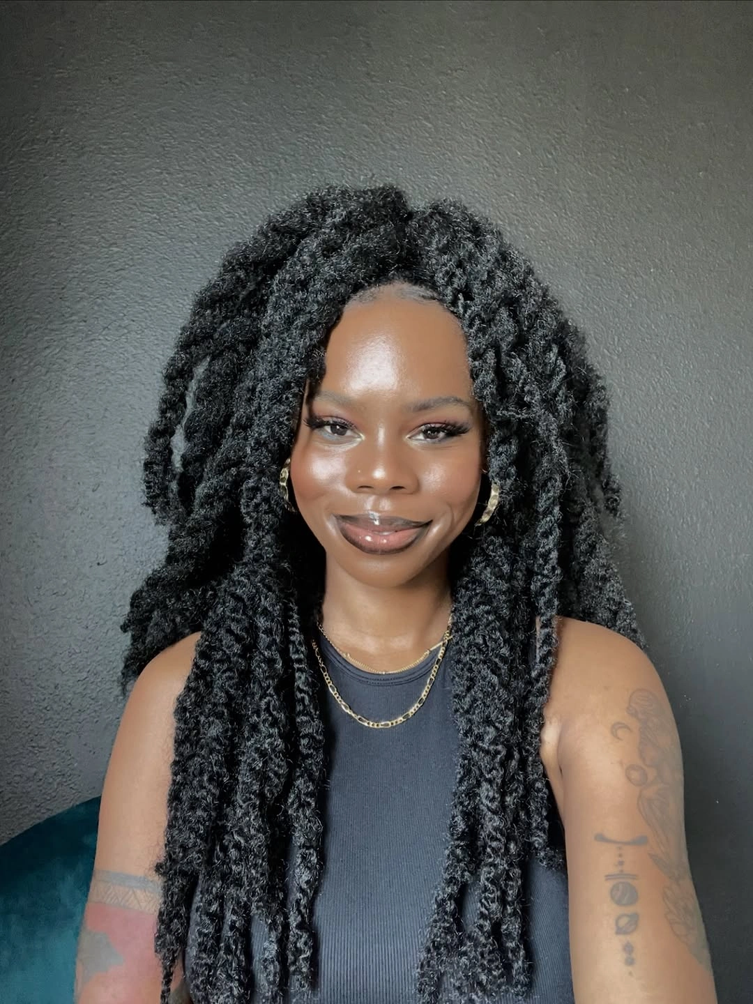 Long black rope-textured lengths with centered part