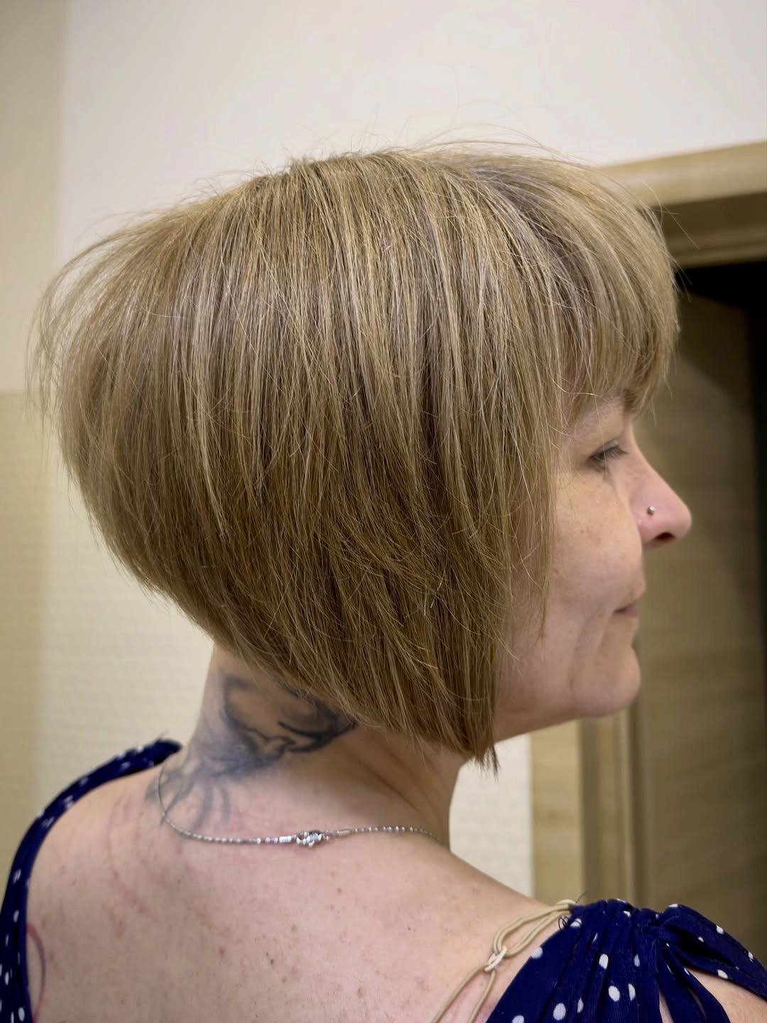 Short rounded blonde bob with side bangs and angled front
