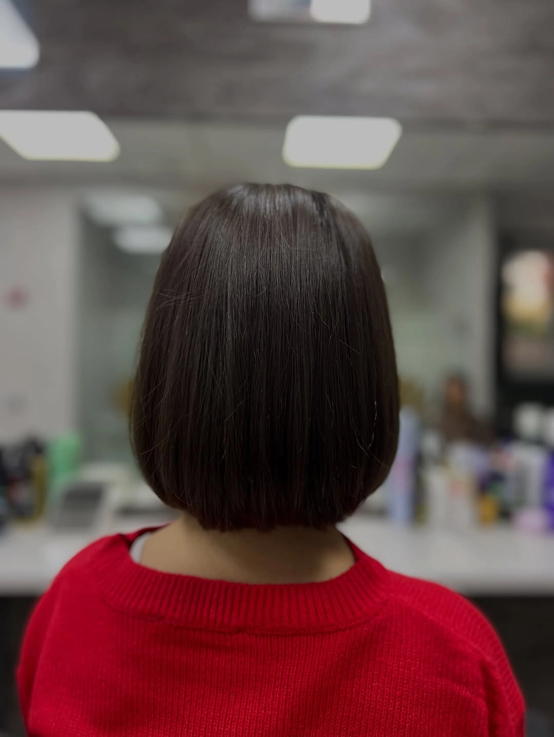 Dark blunt bob from back with compact rounded sides