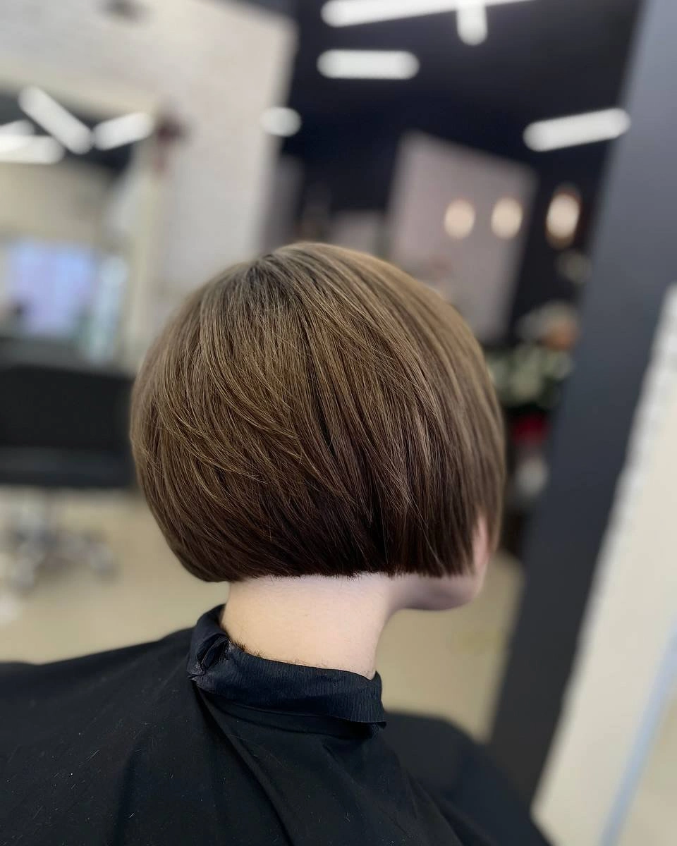 Short brown stacked-looking bob with clean exposed nape