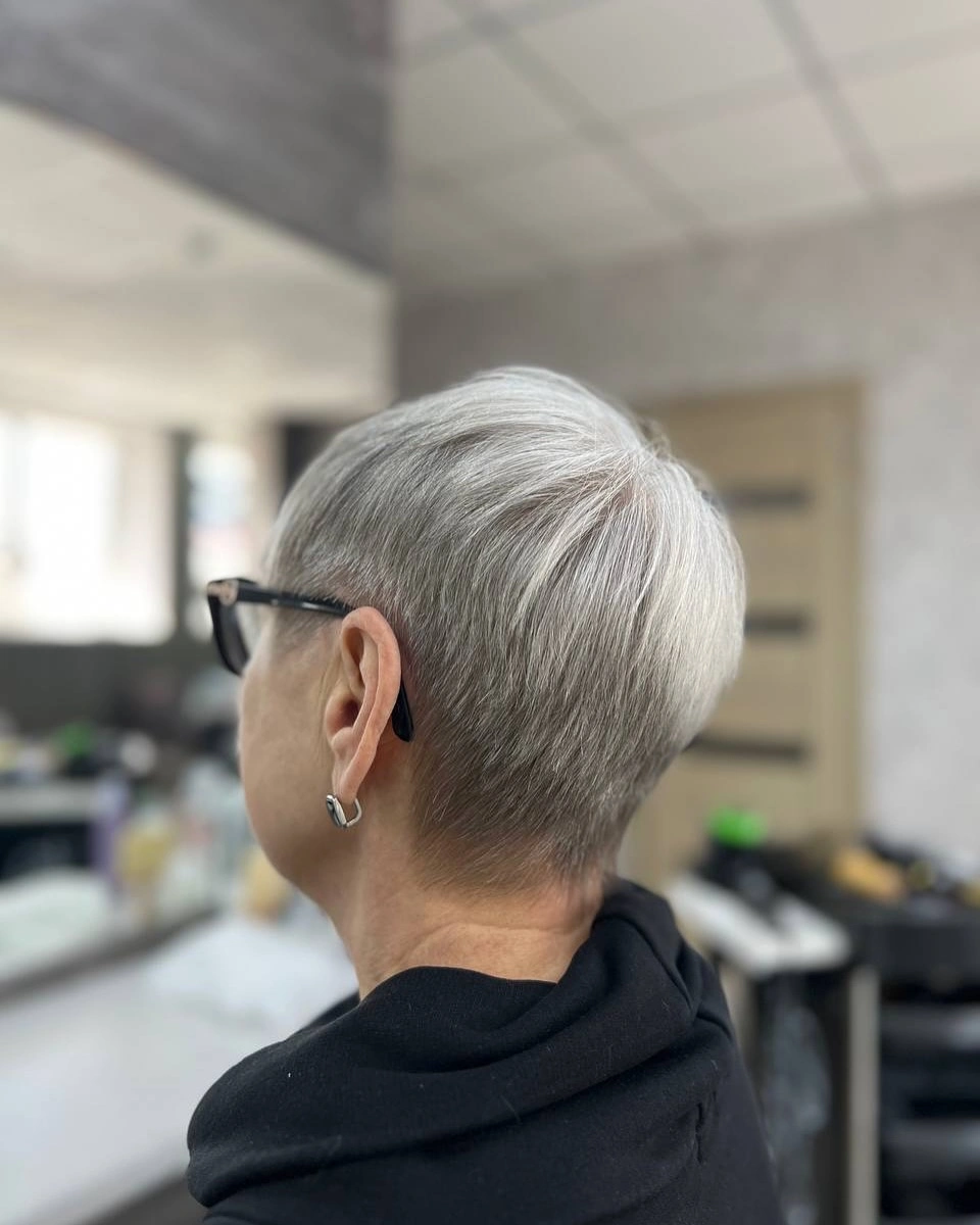 Silver-toned short crop with glasses and neat tapered nape