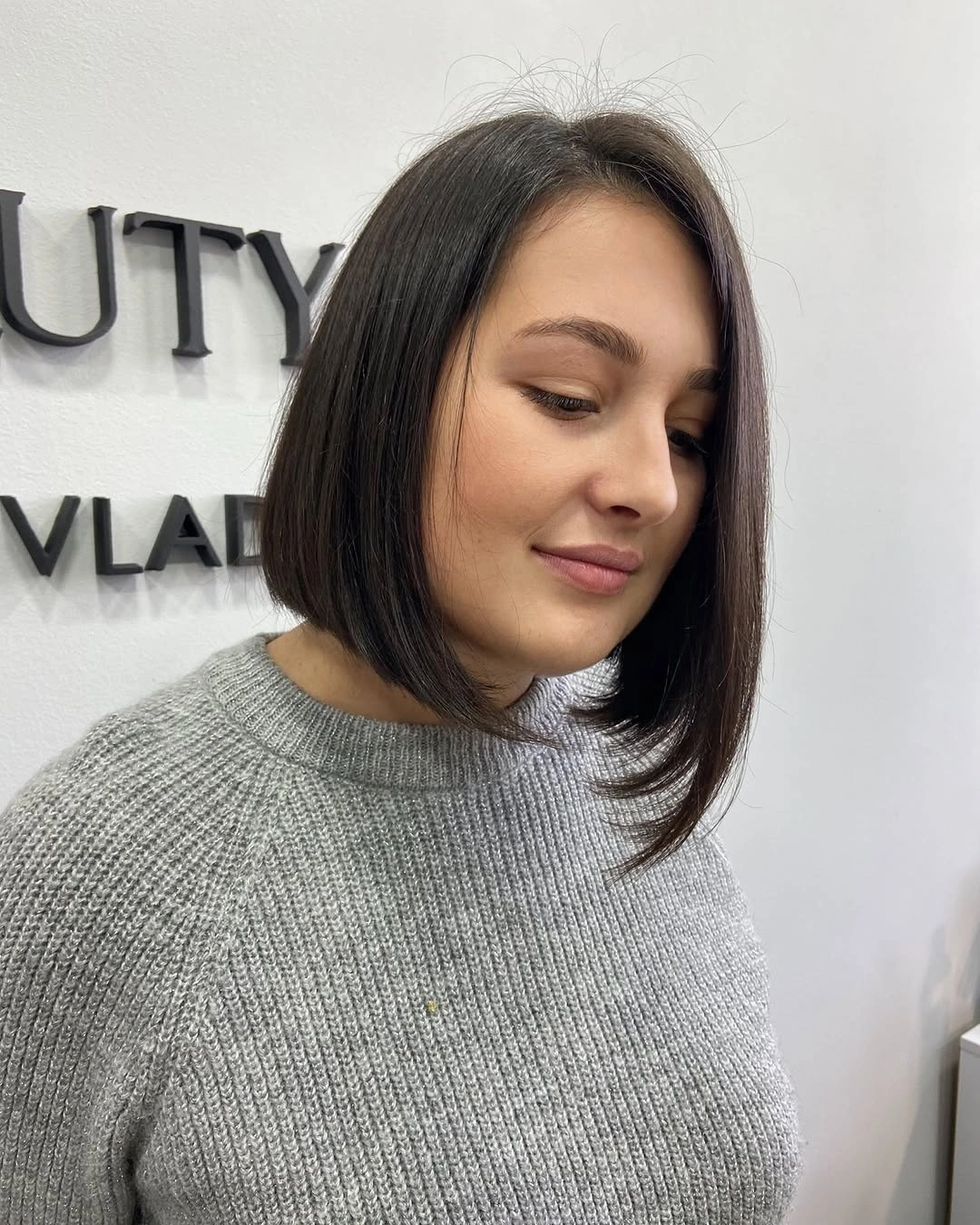 Dark brunette asymmetrical bob with smooth longer front piece
