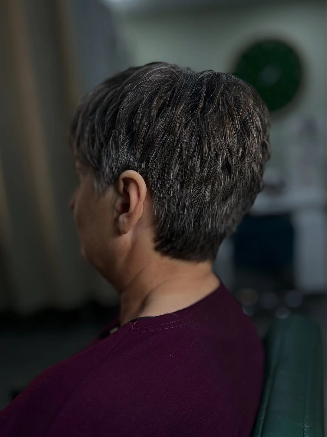 Dark short textured crop with silver-gray strands and close nape