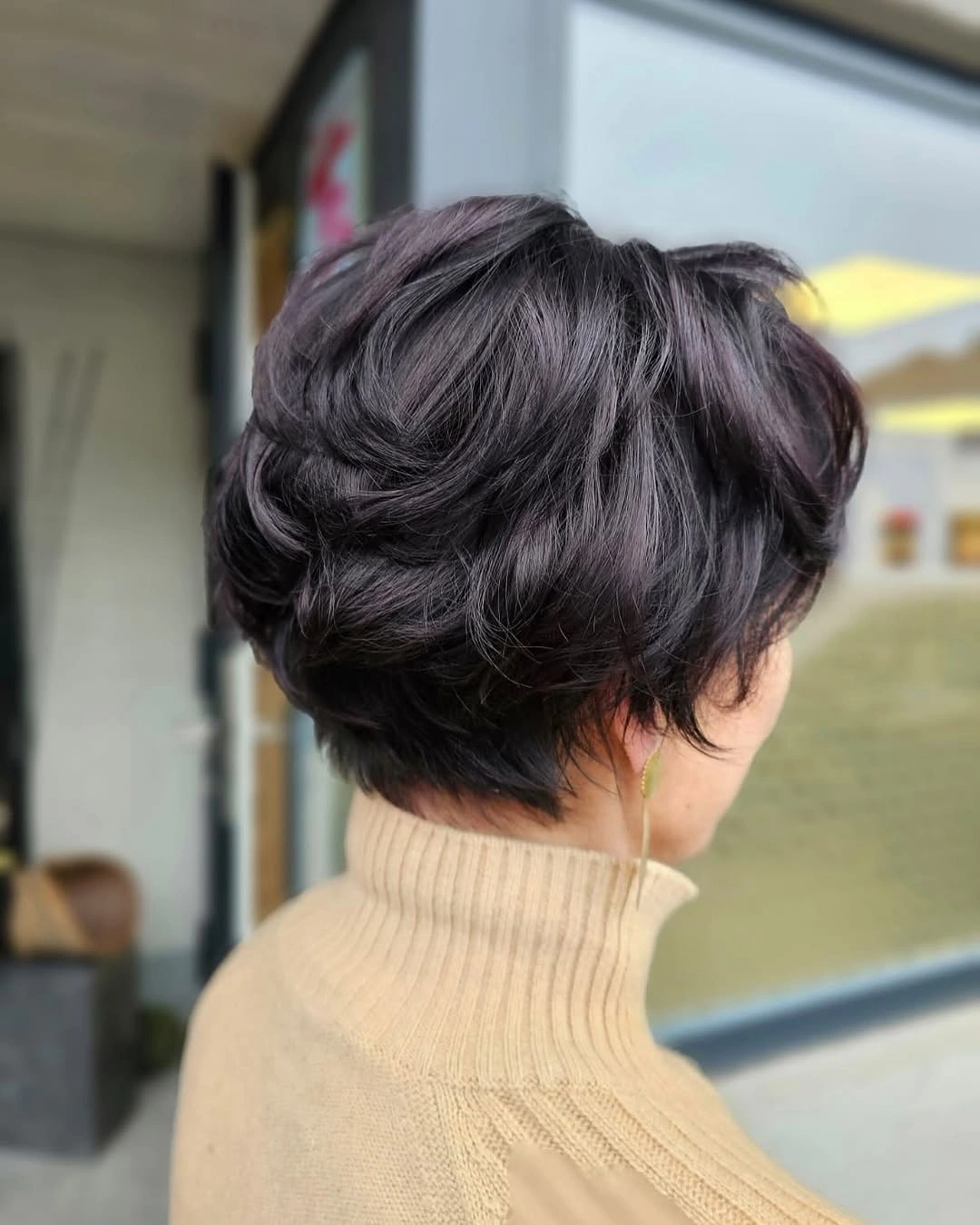 Dark short rounded cut with soft waves and short nape