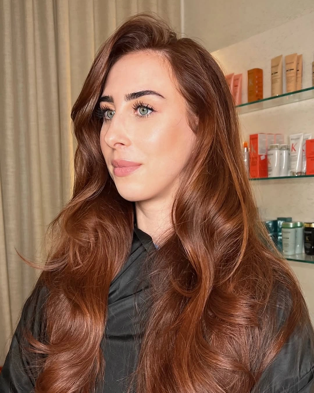 Long auburn hair with broad waves and lifted side front