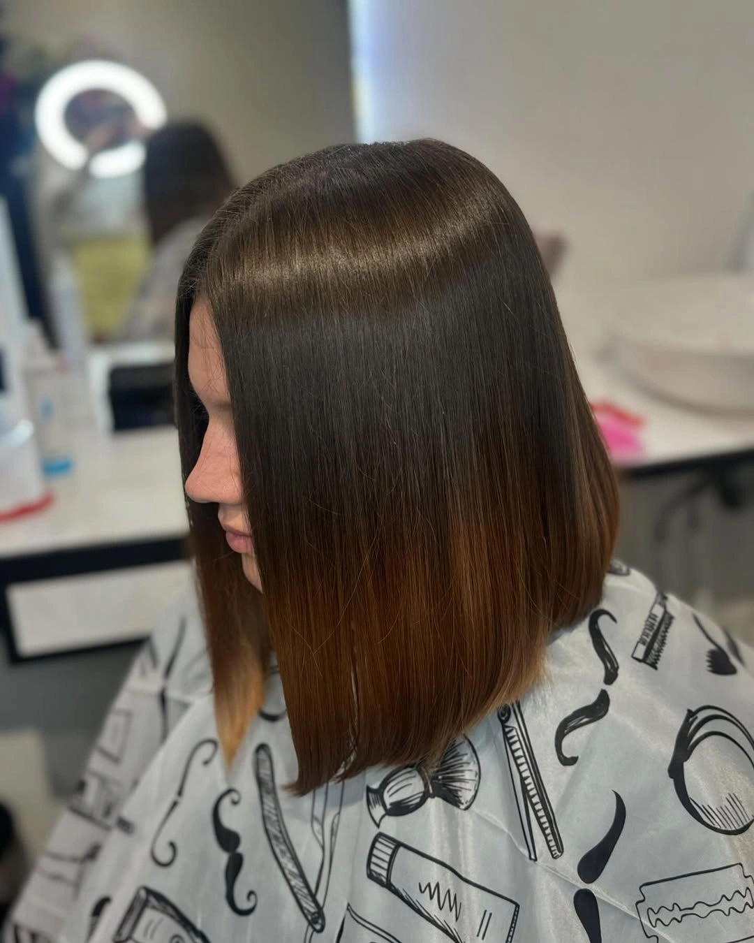 Dark brown blunt lob with sleek straight shoulder-length ends