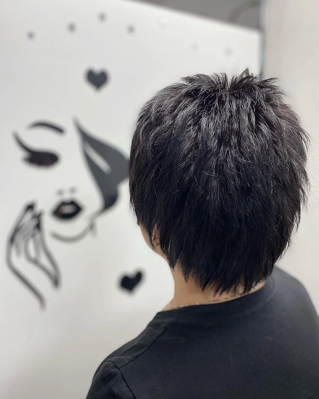 Dark gray pixie with feathered back and tapered nape