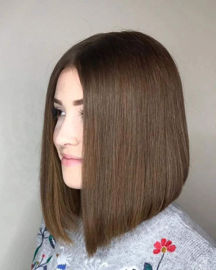 Medium-brown smooth bob with centered part and blunt-looking lower edge
