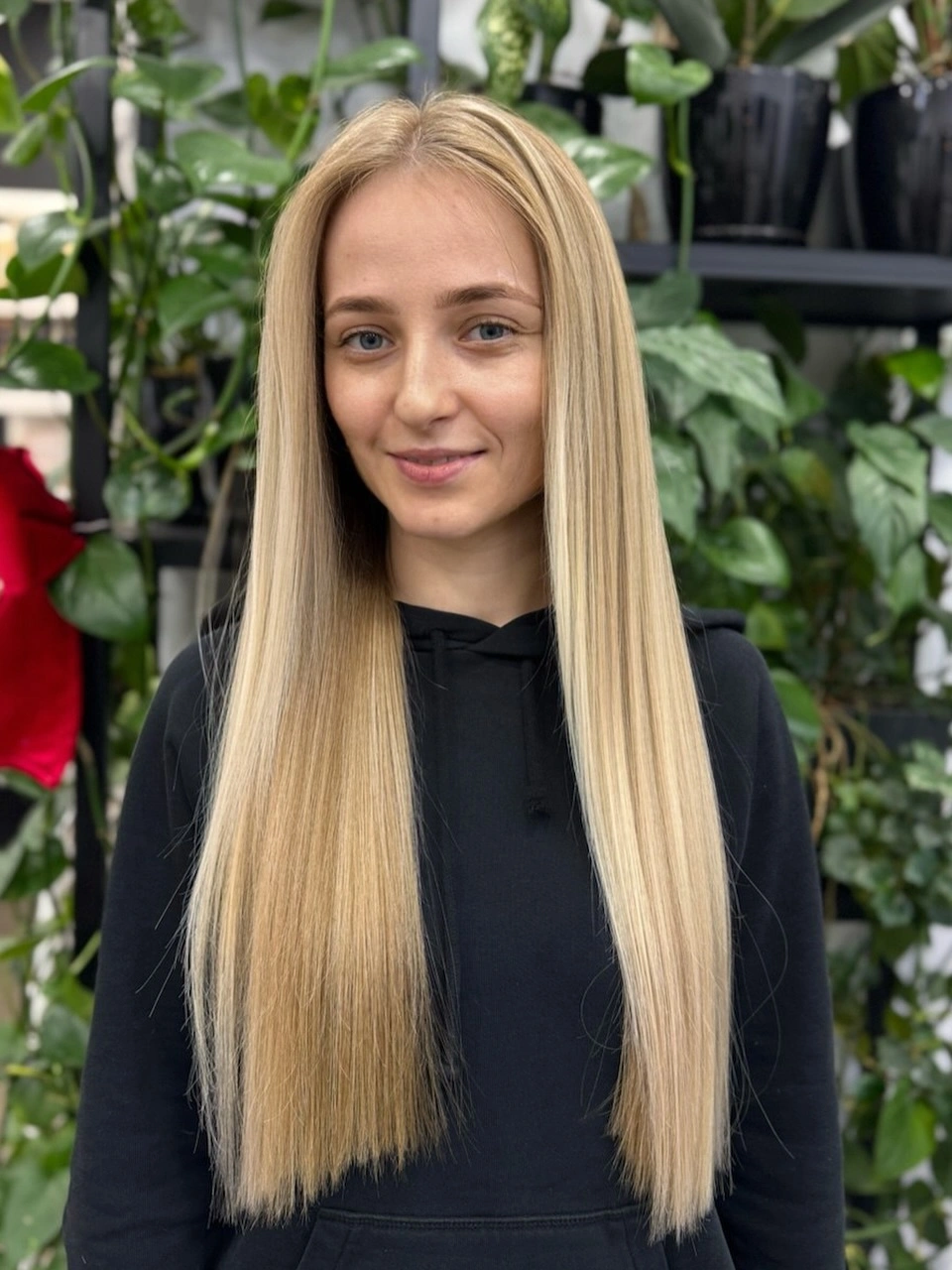 Very long blonde straight hair with centered part and even-looking ends