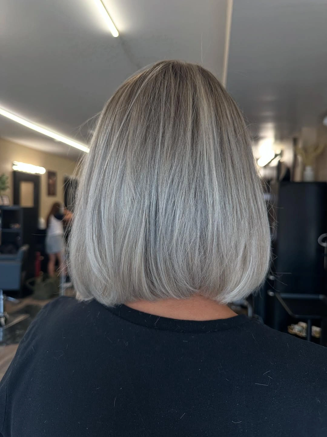 Cool gray-silver bob with smooth surface and rounded lower edge