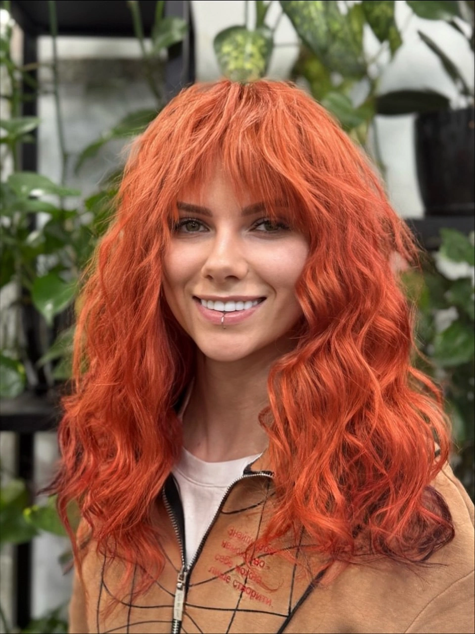 Copper-orange medium-long hair with textured fringe and irregular waves