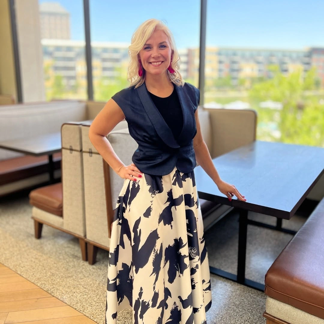 Dark sleeveless layer with cream skirt and abstract black pattern