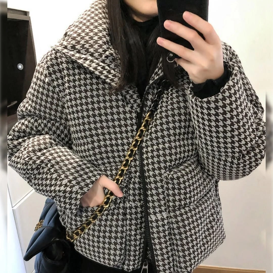 Black and white houndstooth-like puffer with chain bag