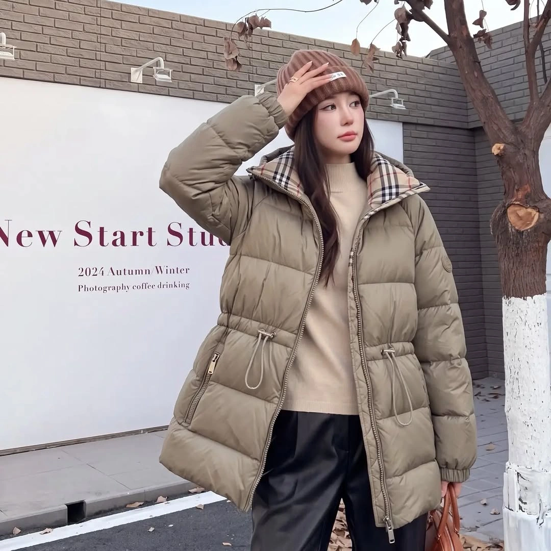 Taupe beige belted puffer with beige hat and black trousers