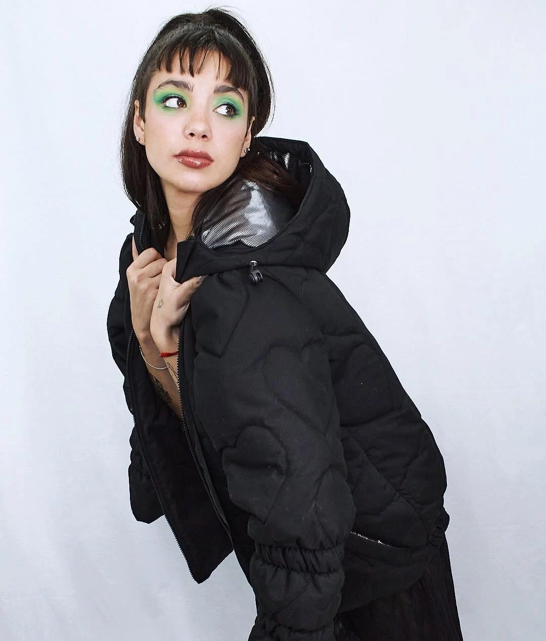 Black hooded puffer with shiny quilted panels