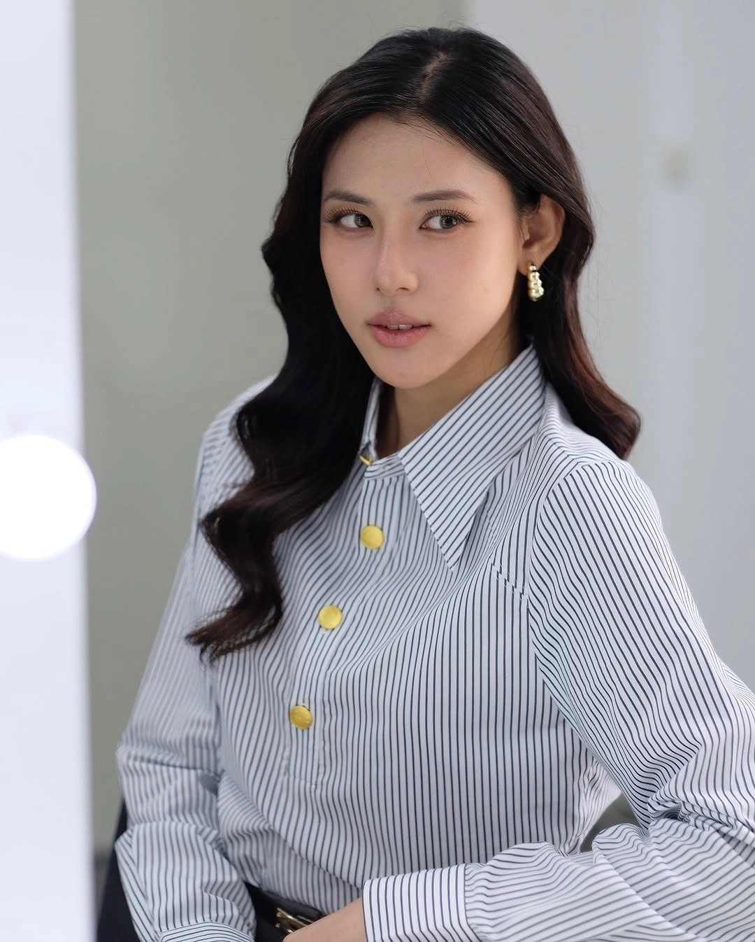 Blue-gray striped shirt with oversized collar and gold-tone buttons