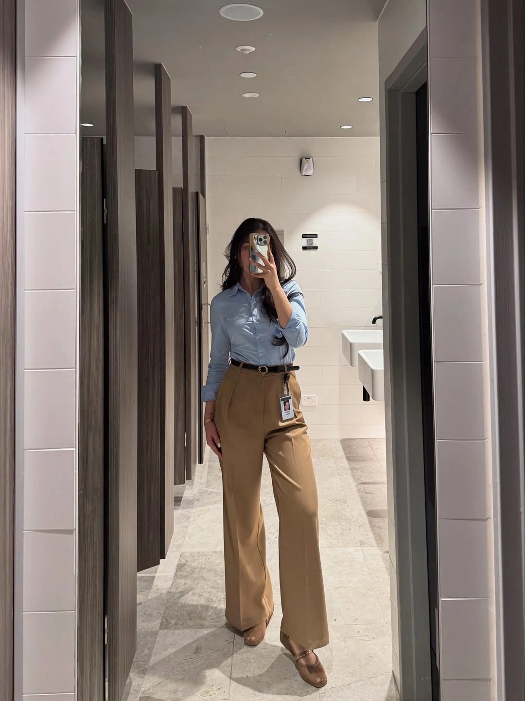 Blue button-up with camel wide-leg trousers and pointed shoes