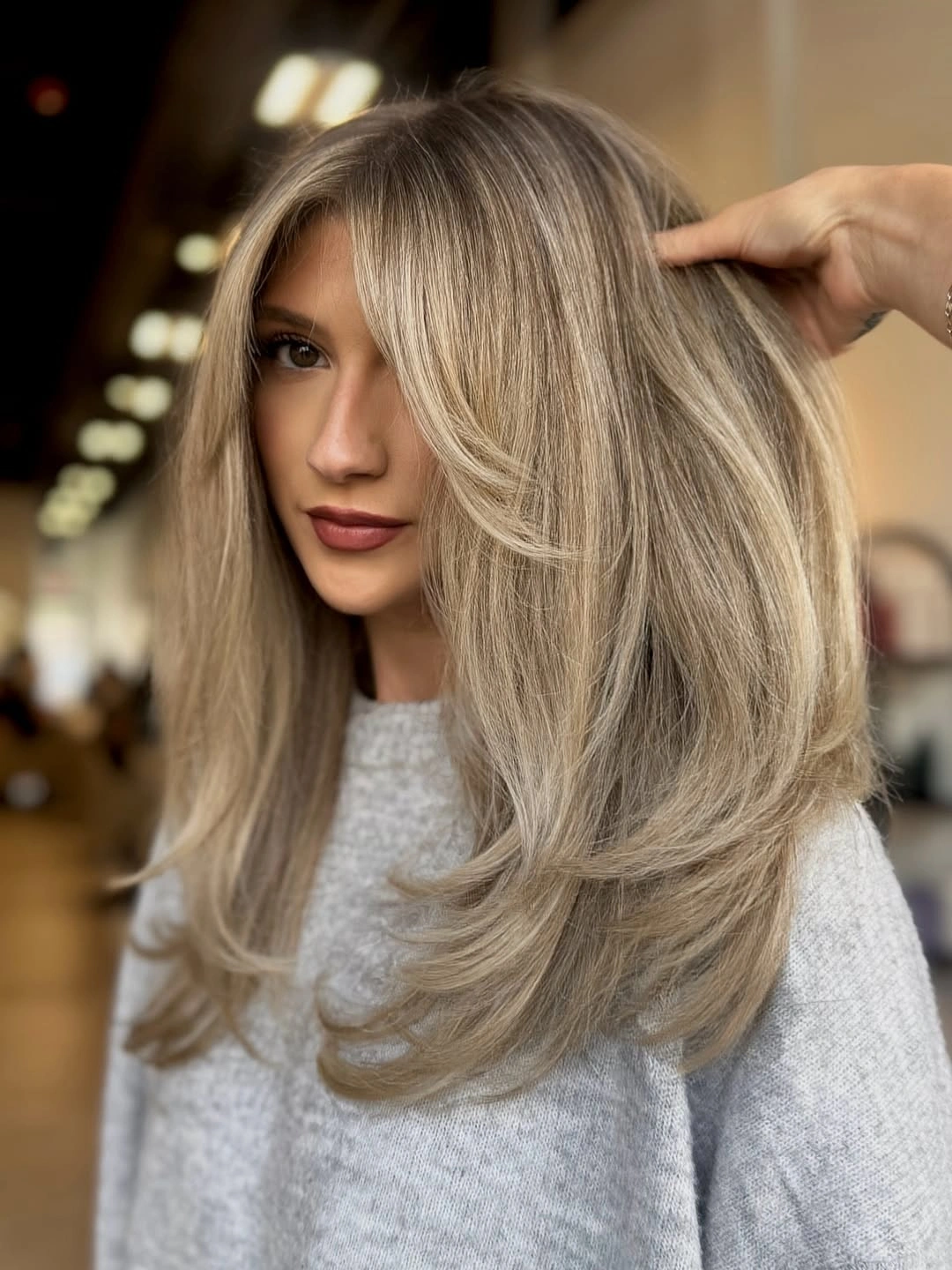 creamy blonde layers with airy curtain fringe
