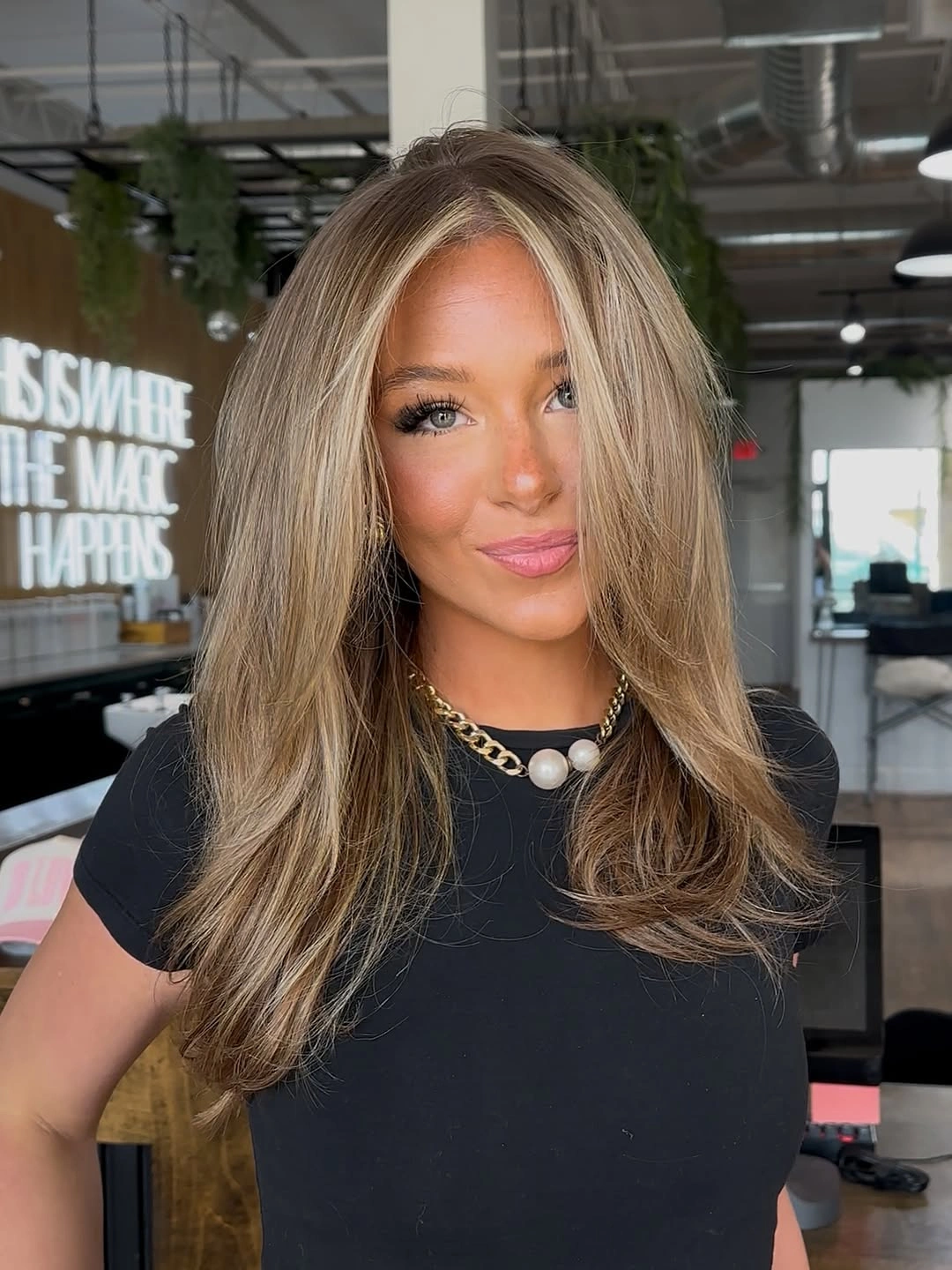 golden-brown layered waves with lighter face-framing pieces