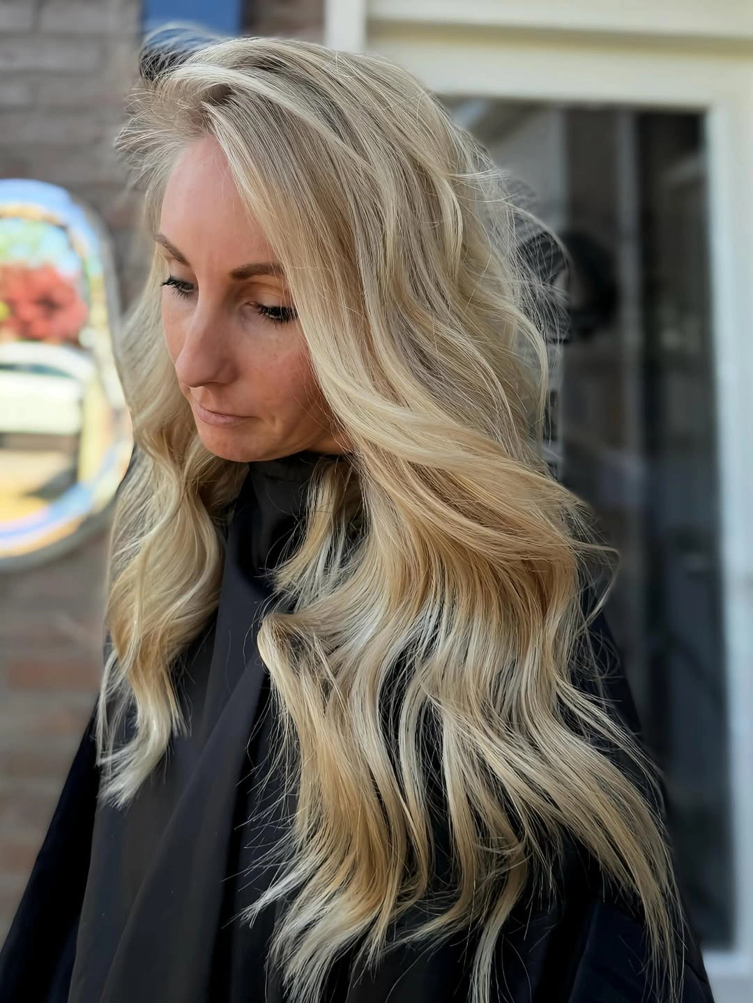 soft blonde waves with a shadowed root