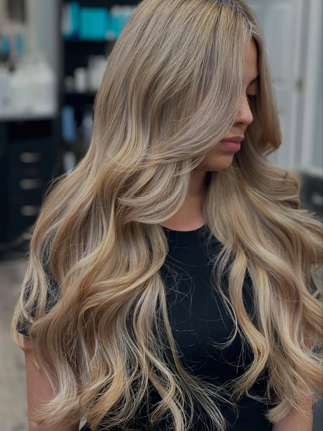 beige dark-blonde waves with long side-swept fringe