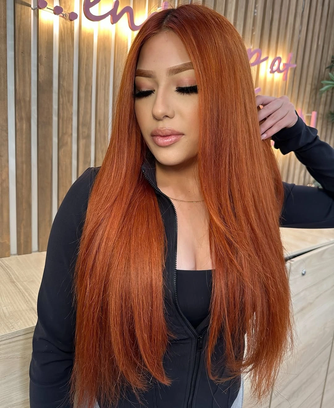 long straight vivid copper-orange hair with a deeper root
