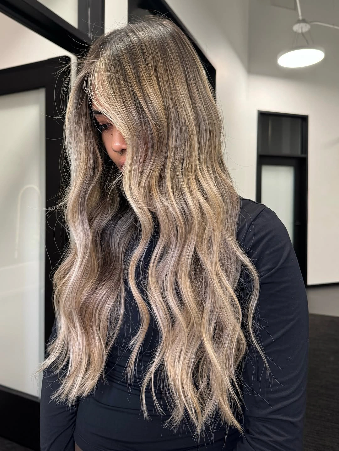dark-rooted waves fading to cool beige and soft silver ends