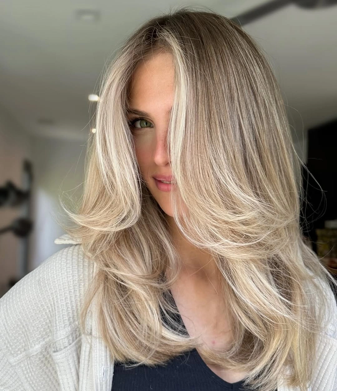 light platinum-blonde long waves with a soft shadowed root