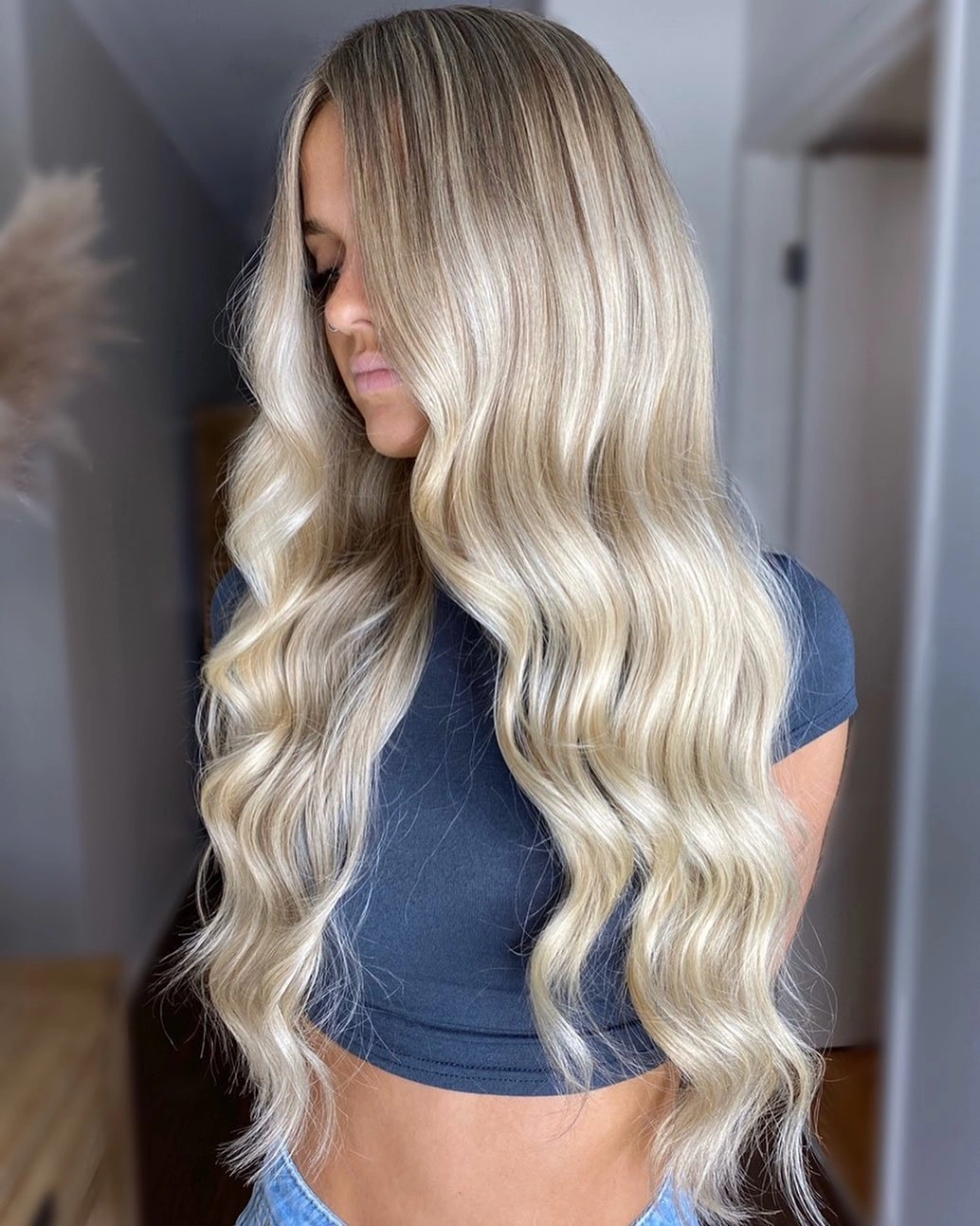Long cool blonde waves with shadowed crown and pale ends