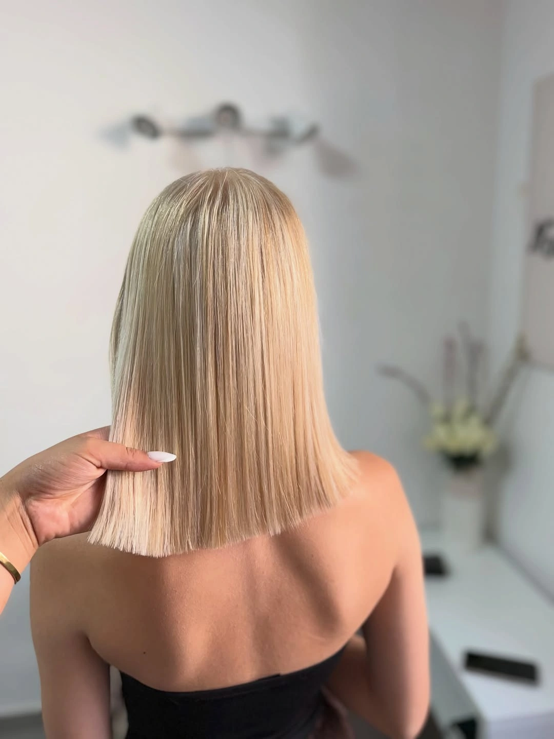 Straight warm blonde bob with smooth blunt ends