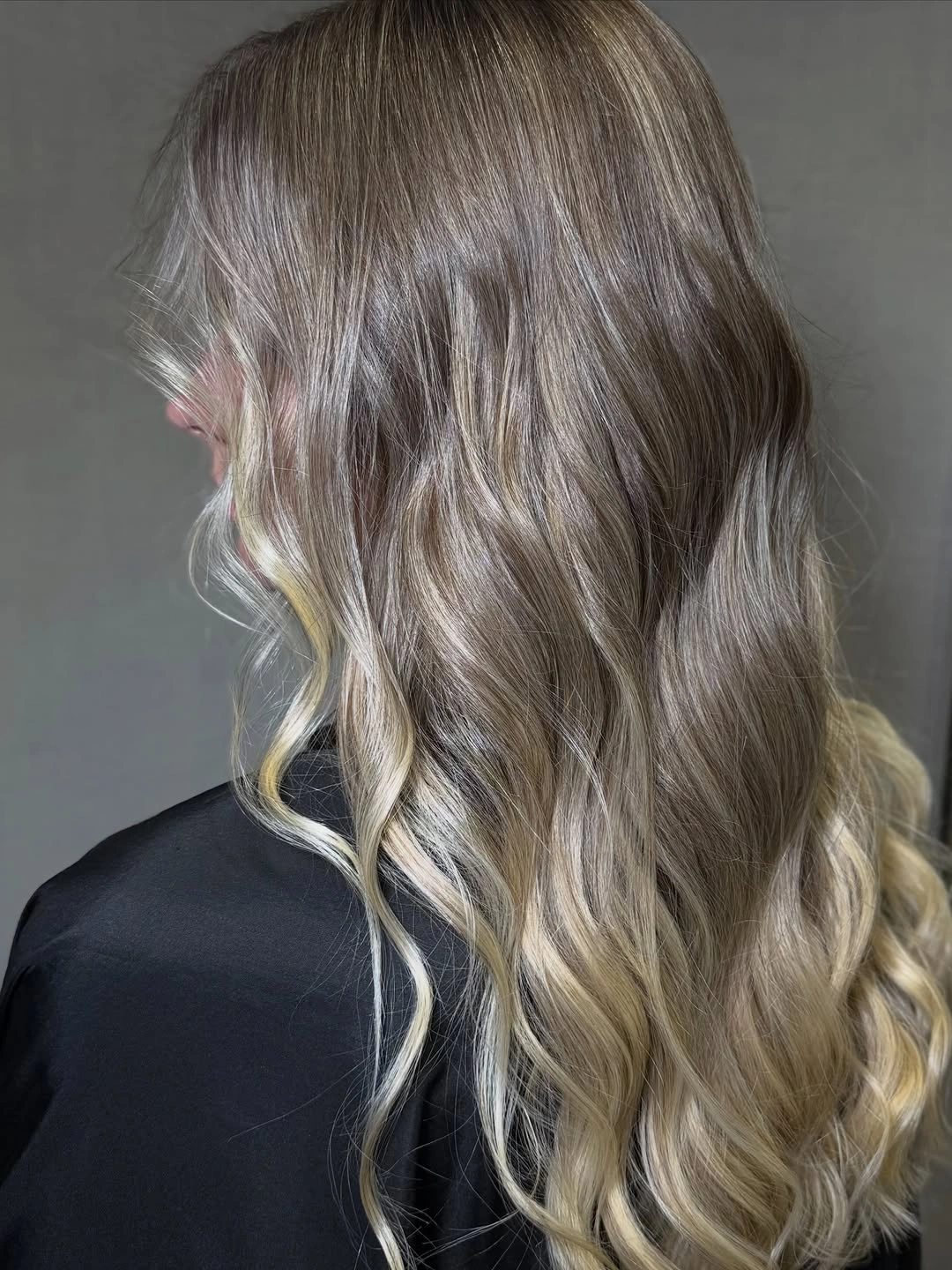 Long ash bronde blonde waves with pale lower curls