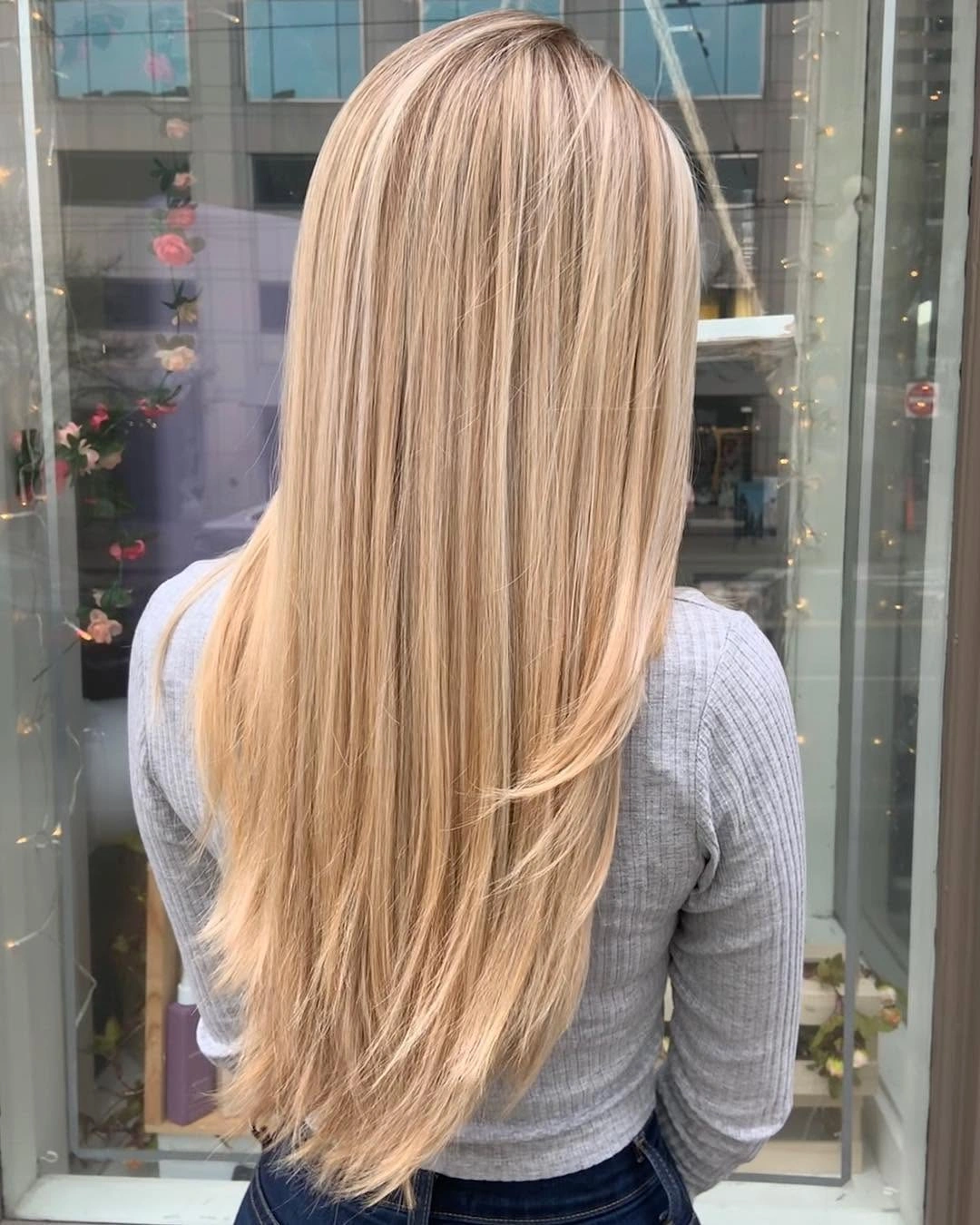 Long straight champagne blonde hair with tapered soft ends