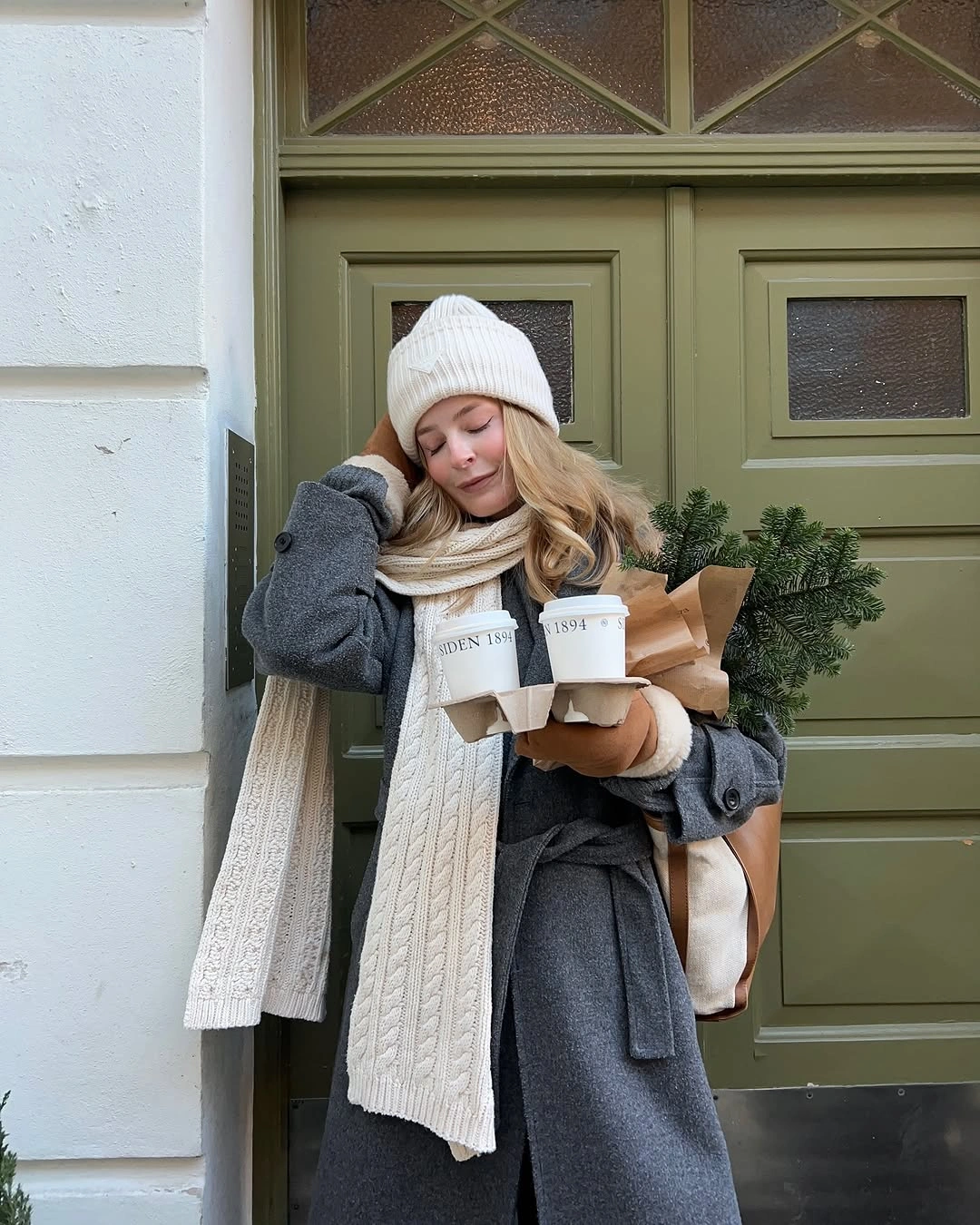 gray coat with white beanie scarf cream knit and dark outer layer