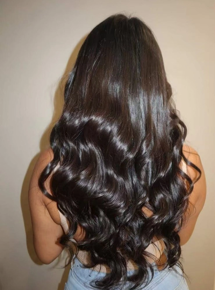 Back view of long glossy near black waves