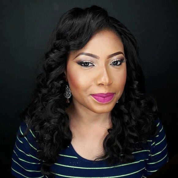 Black side swept curls with polished crown