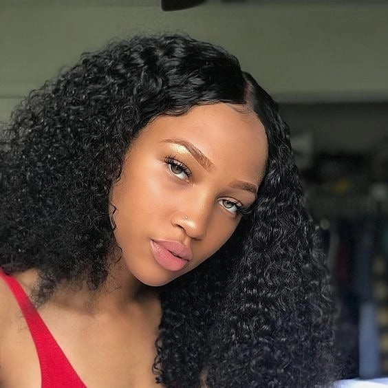 Black curly shoulder length hair with smooth side part