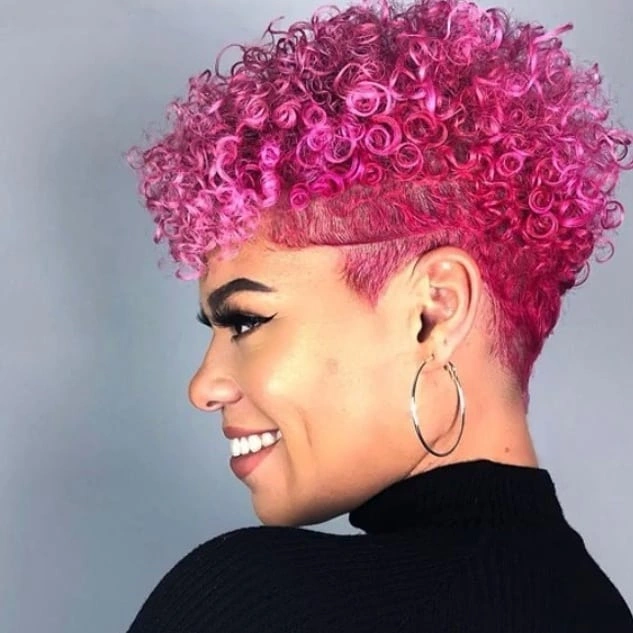 Bright pink cropped curls with short tapered sides