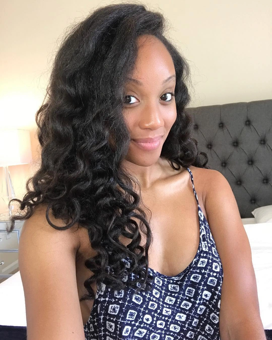 Long near black curls with glossy spiraled ends
