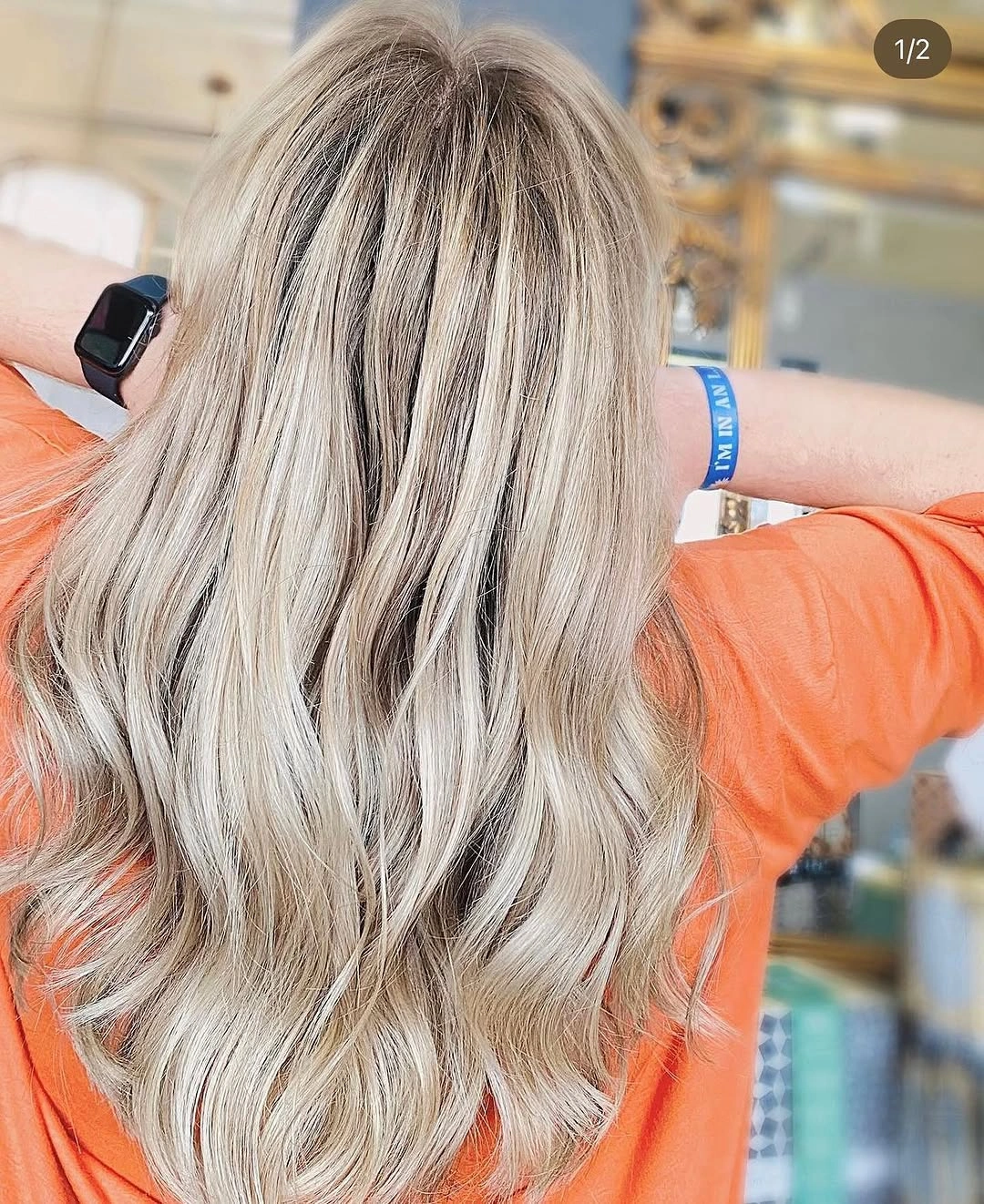 Long wavy silver ash blonde hair with darker roots