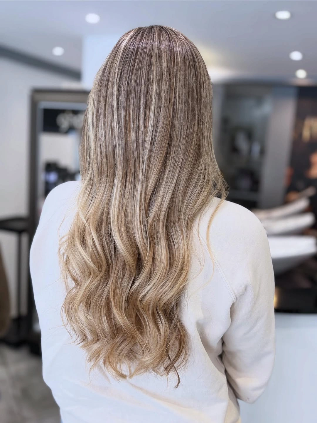 Long wavy beige blonde light brown hair from the back