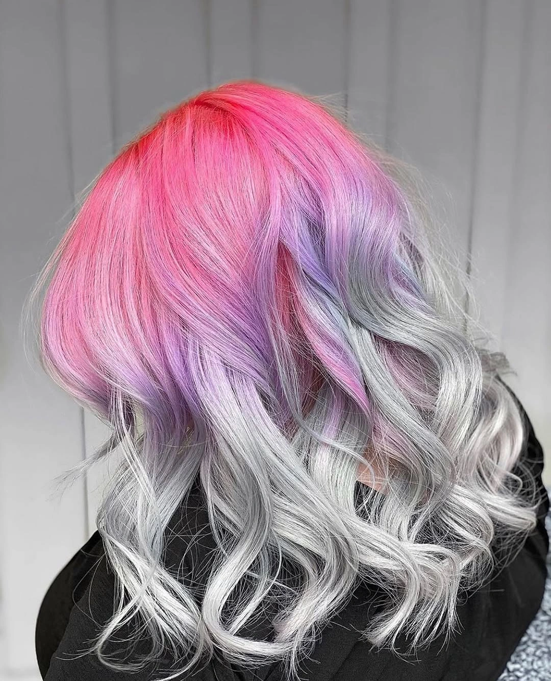 Long wavy hair with pastel pink, lavender, and silver tones