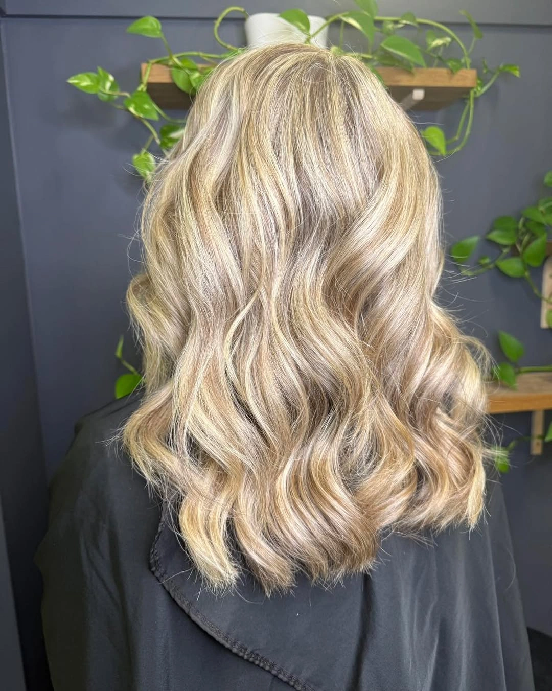 Long wavy pale champagne blonde hair from the back