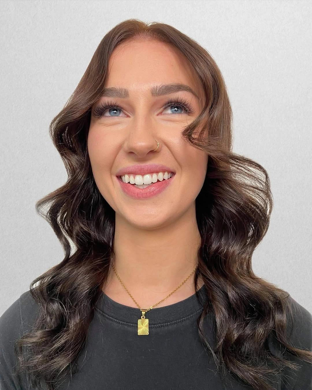 Dark brunette medium-length wavy hair shown from the front