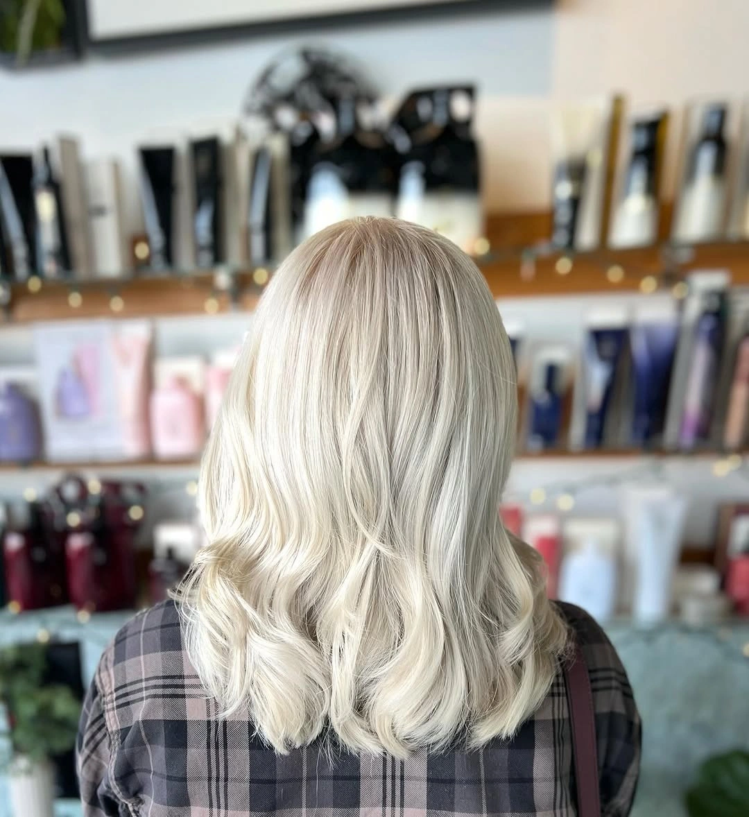 Light wavy shoulder-length hair with layered curled ends