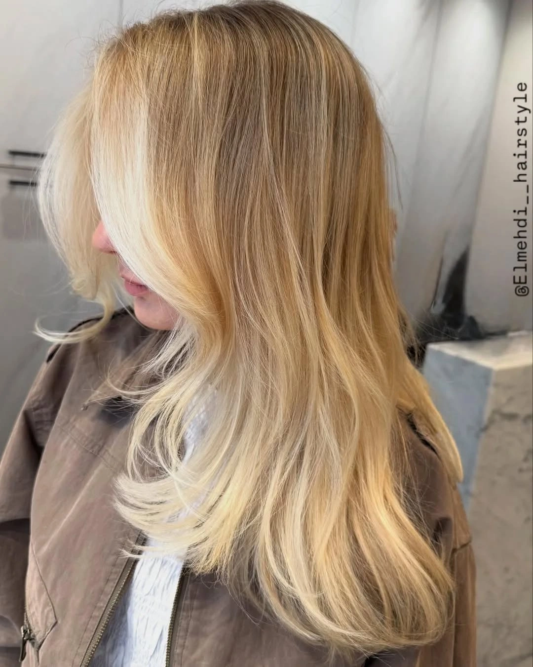 Long blonde layers with sweeping front and curved ends