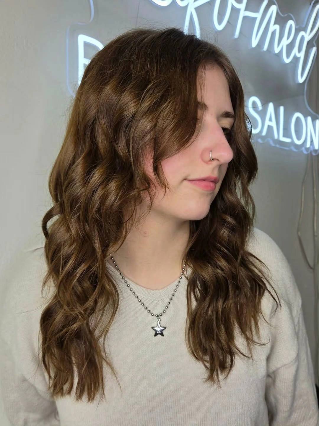 Medium brunette hair with loose waves and center part